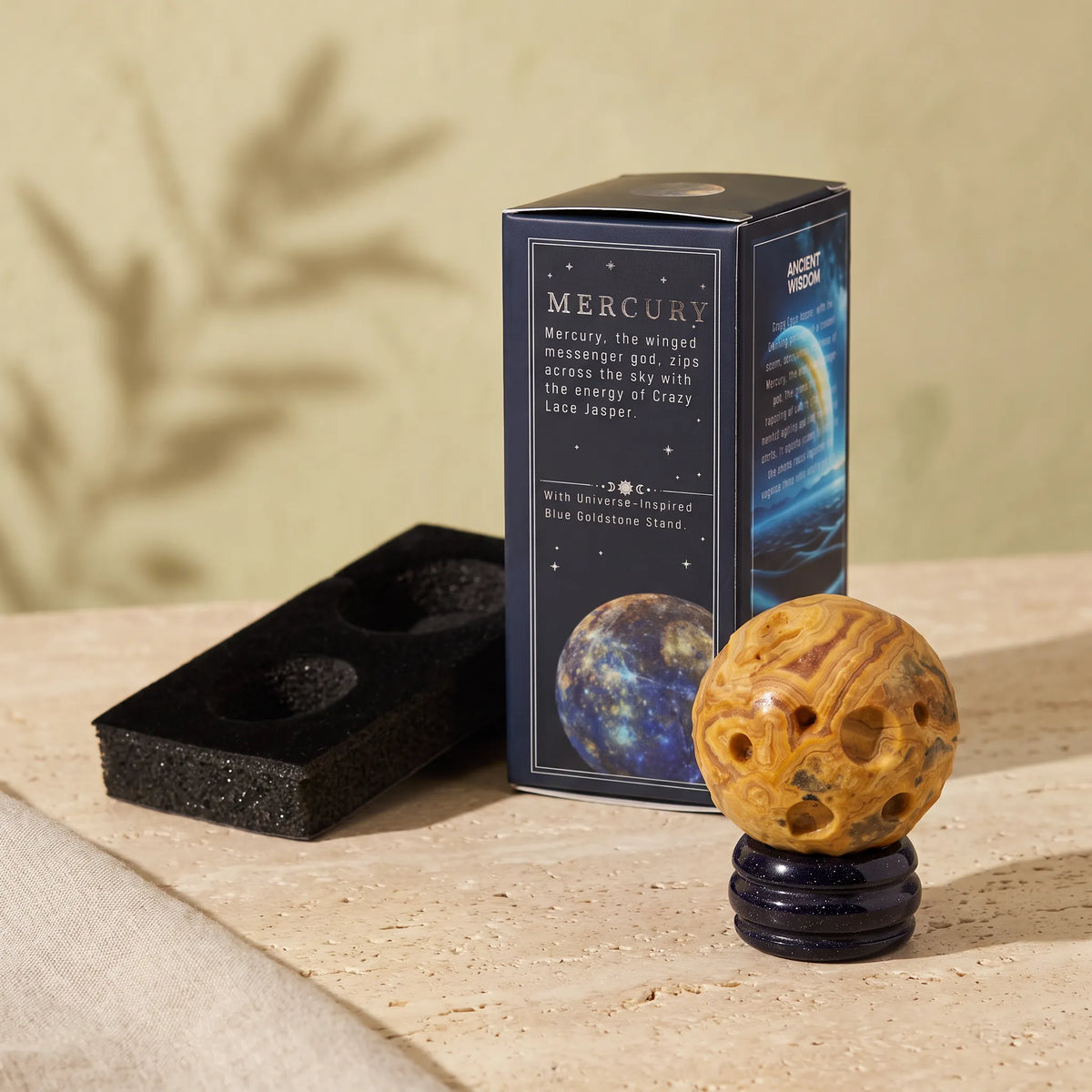 Planeta Mercurio de jaspe encaje loco con soporte azul y caja decorativa inspirada en el planeta Mercurio.